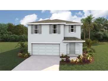Charming two-story home featuring a two-car garage, neutral paint, and inviting front entrance at 30823 Wild Juniper Ct, Brooksville, FL 34602