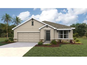 Charming single-story home featuring a two-car garage and beautiful stone accents at 10444 Tucker Rd, Weeki Wachee, FL 34613