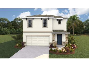 Charming two-story home featuring a two-car garage, stone accents, and a welcoming front entrance at 10466 Tucker Rd, Weeki Wachee, FL 34613