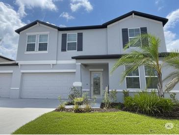Charming two-story home with a well-maintained lawn and a two-car garage at 3522 N Maryland Ave, Plant City, FL 33565