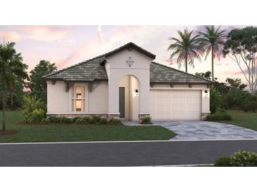 One-story home with a two-car garage and landscaped yard at 228 Vistera Blvd, Nokomis, FL 34275
