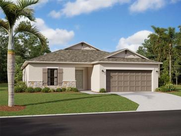 One-story home with a two-car garage, stone accents, and landscaping at 5210 Patano Loop, Palmetto, FL 34221