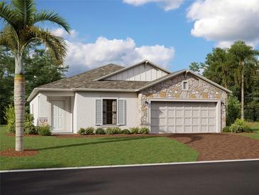 One-story home with stone accents and a two-car garage at 9820 Last Light Gln, Parrish, FL 34219