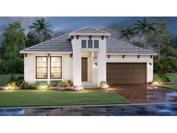 Beautiful one-story home featuring a brick-paved driveway, two car garage, and well-manicured landscaping at 17126 Savory Mist Cir, Bradenton, FL 34211