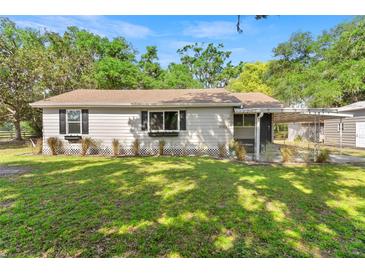 Charming single-story home features a well-maintained lawn and classic design at 3703 Cooper Rd, Plant City, FL 33565