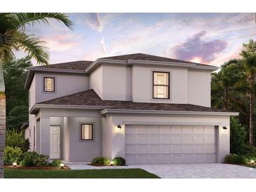 Charming two-story home with a two-car garage and well-manicured lawn in a residential neighborhood at 16854 Fiesta Dr, Port Charlotte, FL 33953