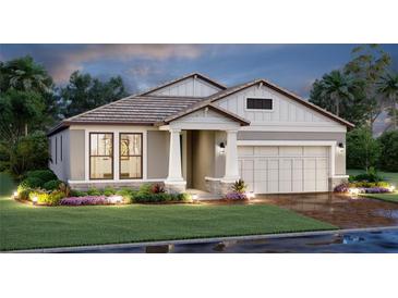 Charming single-Gathering home with a two-car garage, manicured lawn, and inviting entrance at 17224 Savory Mist Cir, Bradenton, FL 34211