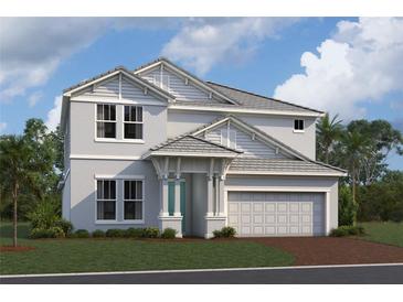 Charming two-story home with a two-car garage, manicured lawn, and well-maintained landscaping at 7544 Nighthawk Dr, Sarasota, FL 34241