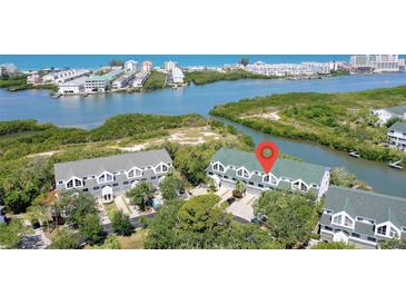 Waterfront condos offer scenic views and tranquil living near lush mangroves and sparkling waters at 9874 Indian Key Trl # 62, Seminole, FL 33776