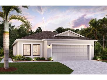 Charming single-Gathering home with manicured lawn and a two-car garage for convenient parking at 16866 Fiesta Dr, Port Charlotte, FL 33953