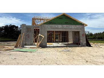 An up-close construction of a modern home showing the block and ZIP System sheathing in the framing process at 7930 Chandler Lake Ct, Hudson, FL 34667