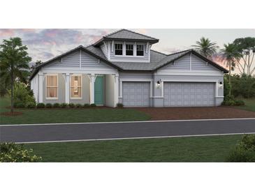 Charming single-story home featuring a two-car garage, a teal-colored front door, and craftsman-style details at 16811 Sweetwater Village Dr, Lakewood Ranch, FL 34211