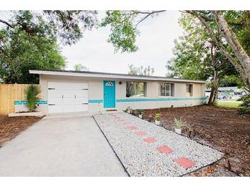 Charming ranch house with a newly paved driveway and landscaping at 4615 Lords Ave, Sarasota, FL 34231