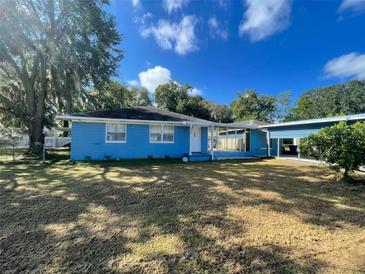 Ranch-style home with blue exterior and large yard at 3305 Hickman Ave, Plant City, FL 33563