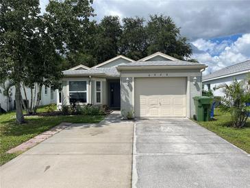 Single-story home with a one car garage and a well maintained lawn at 6028 40 Nw Ave, Bradenton, FL 34209