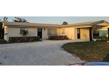 Charming single-story home features fresh exterior paint, a welcoming entrance, and a well-kept yard at 460 Creek Lane Dr, Englewood, FL 34223