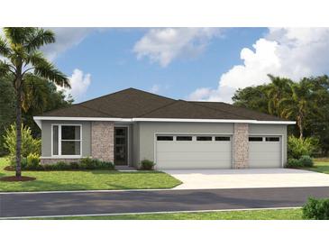 Charming single-story home with a two-car garage and beautifully manicured lawn at 9143 Players Dr, Weeki Wachee, FL 34613