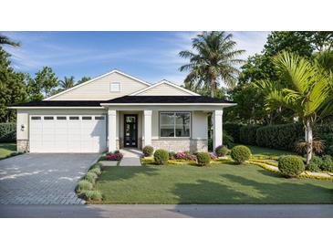 Charming single-story home boasting manicured landscaping, elegant stonework, and a welcoming two-car garage at 487 Sunset N Rd, Rotonda West, FL 33947