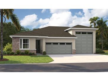 Charming single-story home with stone accents, three-car garage, and well-manicured lawn at 9136 Players Dr, Weeki Wachee, FL 34613