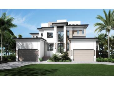 Stunning two-story modern home with a well-manicured lawn and attached garages at 2417 S Dundee St, Tampa, FL 33629