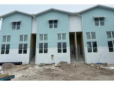 New construction of three-story townhouses with light blue siding at 3850 Pompano Se Dr # 2, St Petersburg, FL 33705