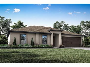 One-story home with tan exterior, brown garage door, and manicured landscaping at 5952 Gillot Blvd, Port Charlotte, FL 33981