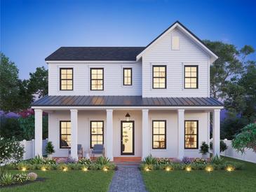 Two-story farmhouse with a wraparound porch, and landscaping at 109 13Th N Ave, St Petersburg, FL 33701