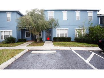 Two-story blue building with parking at 12811 Kings Crossing Dr, Gibsonton, FL 33534