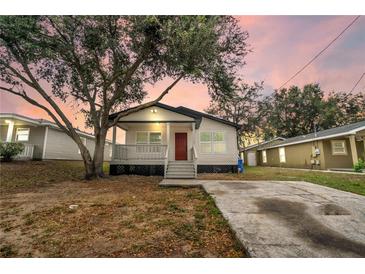 Newly built single story home with front porch at 3721 Wiggins Leaf St, Tampa, FL 33619