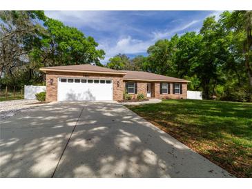 Photo one of 34671 Dogwood Dr Dade City FL 33523 | MLS T3511197