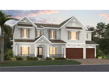 Two-story home with gray siding, brown accents, and a two-car garage at 4010 W Watrous Ave, Tampa, FL 33629