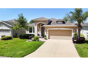 Beautiful one-story home with two car garage and manicured lawn at 29405 Cochiti Lake Dr, San Antonio, FL 33576