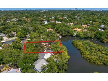 Aerial view of waterfront property with house at 4710 W Laurel Rd, Tampa, FL 33629