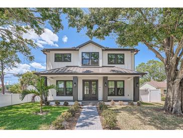 Modern farmhouse style home with dark gray metal roof at 325 33Rd N Ave, St Petersburg, FL 33704
