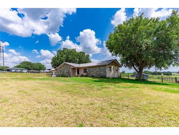 Ranch-style home with stone accents on a large lot at 31226 Saint Joe Rd, Dade City, FL 33525