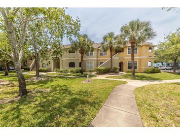 Two-story building with lush landscaping and walkways at 1228 S. Missouri Ave # 607, Clearwater, FL 33756