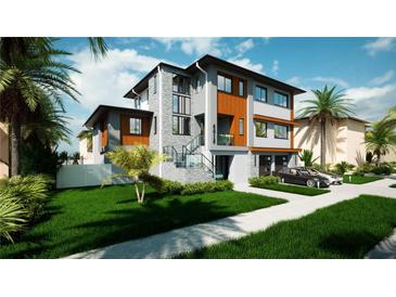 Modern two-story house with gray and wood accents at 6018 Kipps Colony E Dr, Gulfport, FL 33707