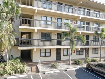 Exterior view of building, showing landscaping and parking at 315 30Th W Ave # B207, Bradenton, FL 34205