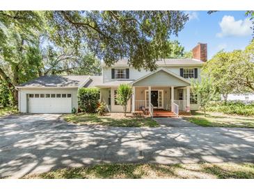 Charming two-story home with an attached two-car garage and beautifully landscaped front yard at 6605 Pemberton Sage Ct, Seffner, FL 33584
