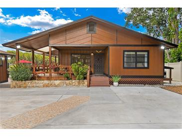 Attractive single-story home with wood siding and large front porch at 17501 Brown Rd, Odessa, FL 33556