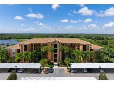 Luxury condo building with parking and water views at 8403 Grand Estuary Trl # 106, Bradenton, FL 34212