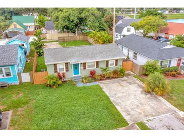 Charming single-story home with blue door, neat landscaping, and a driveway; a welcoming curb appeal at 2866 15Th N Ave, St Petersburg, FL 33713