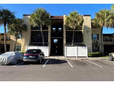 Two-story building with parking and tropical landscaping at 5306 Santa Rosa Ct # 342, Tampa, FL 33609