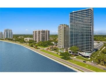 Aerial view of waterfront high-rise condos with lush landscaping at 2912 W Santiago St # 1703, Tampa, FL 33629
