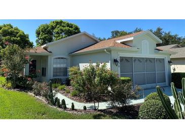 One-story house with landscaped yard at 11230 Heathrow Ave, Spring Hill, FL 34609