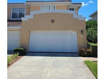 Townhouse exterior with a double-car garage at 277 Valencia Cir, St Petersburg, FL 33716