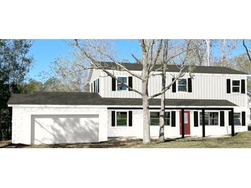 Charming two-story home featuring black shutters and a welcoming front porch at 849 Laurelridge Ct, Brooksville, FL 34601
