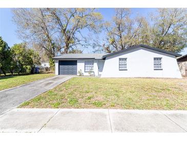 Charming single-story home features a well-maintained front yard and attached garage at 3432 Danny Bryan Blvd, Tampa, FL 33619