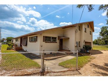 Single-Gathering home with attached garage and fenced yard at 4904 N Habana Ave, Tampa, FL 33614