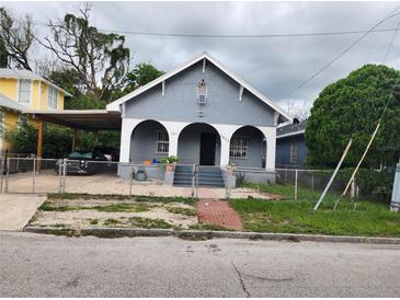 A charming bungalow style home with a covered carport at 2825 N Taliaferro Ave, Tampa, FL 33602